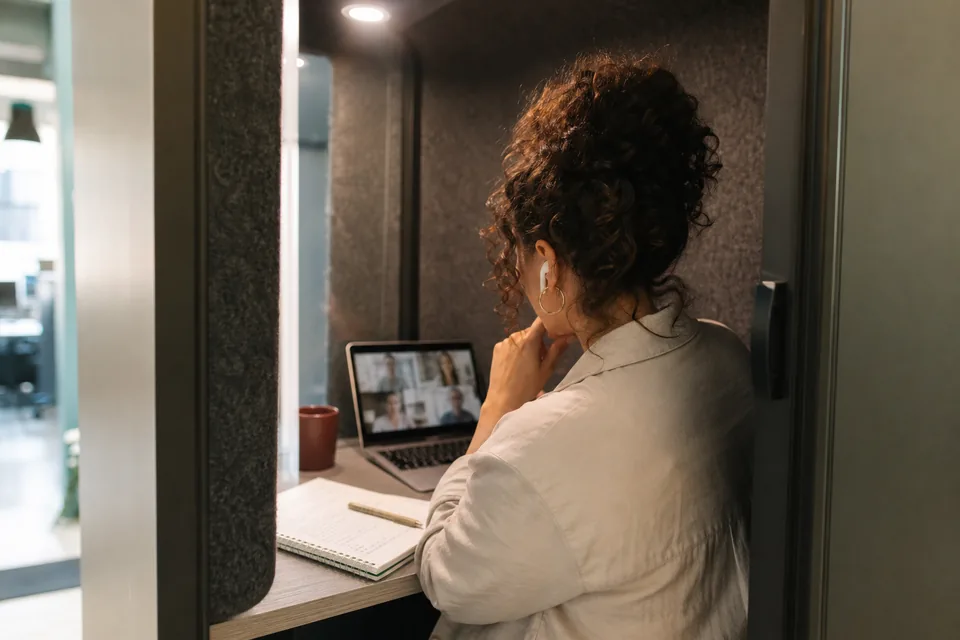 Project coordinator sharing a spreadsheet with a remote colleague on a video call